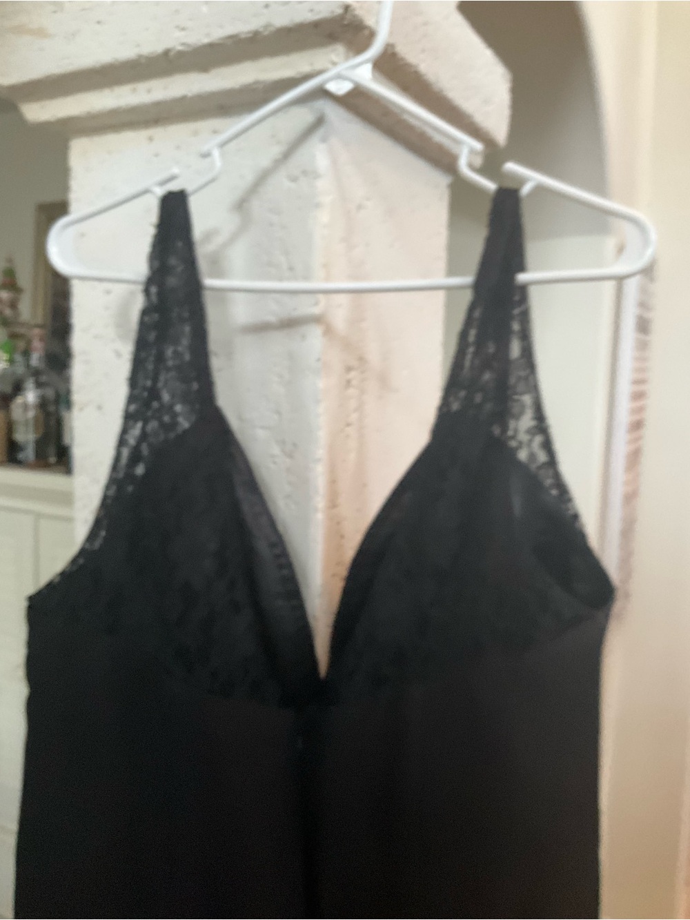 M Llanoo Black Lace-Trim formal gown with short train.
